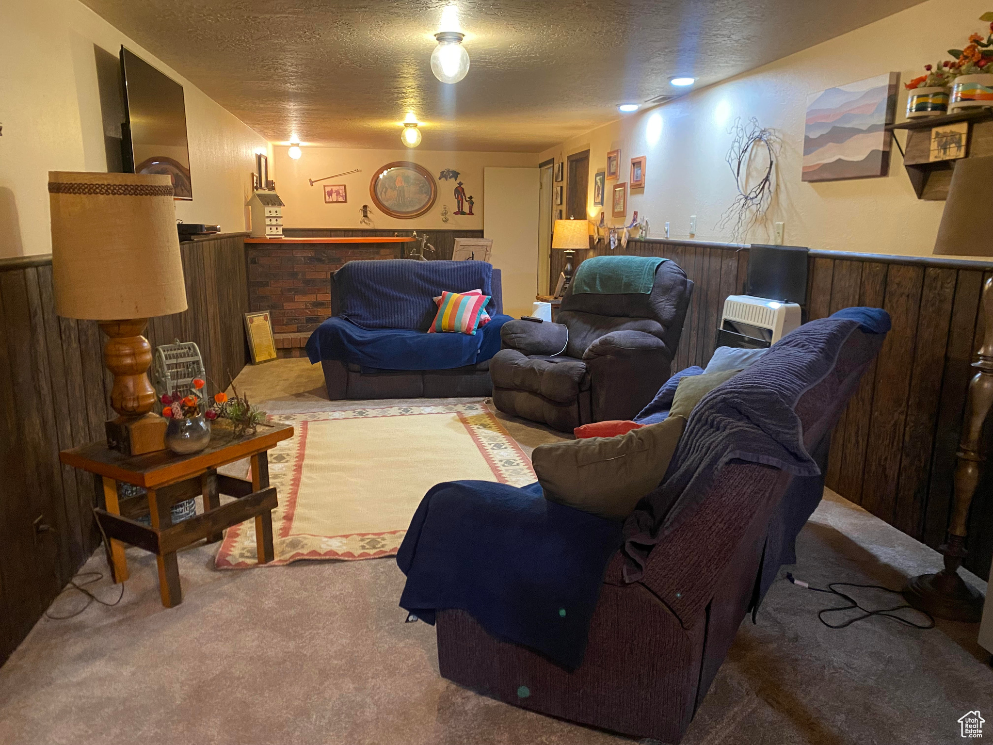 cozy den/ family room downstairs with fireplace