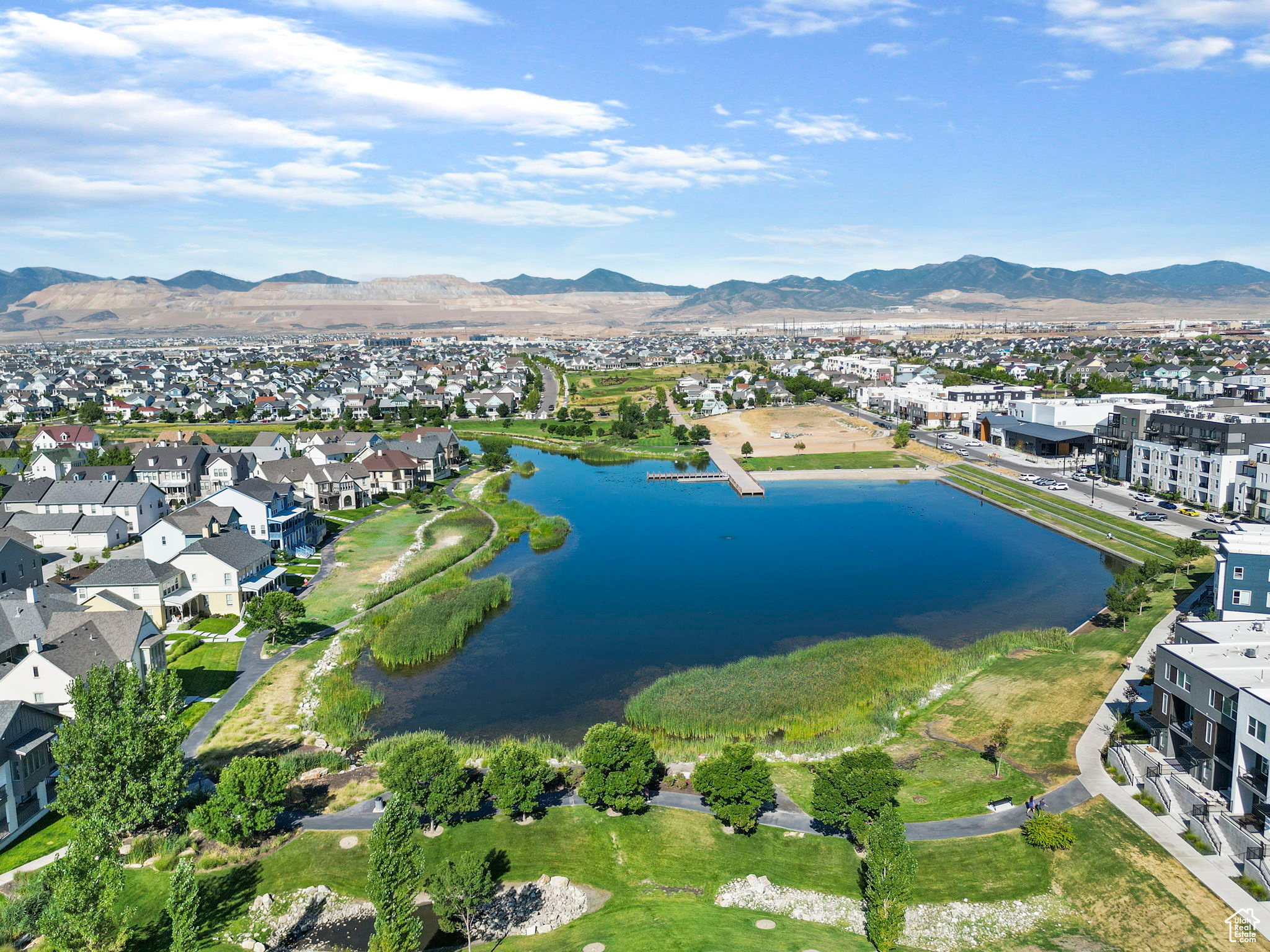 Birds eye view of property featuring a water and mountain view