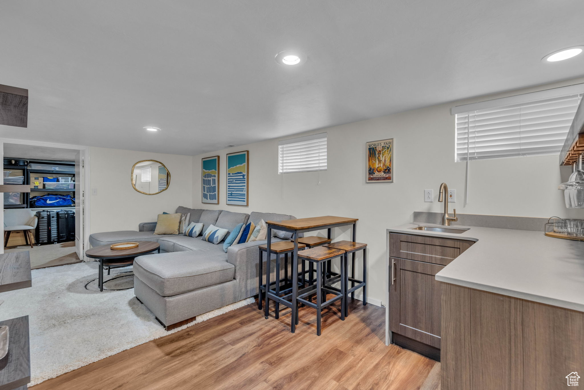 Living room featuring sink and light hardwood / wood-style floors