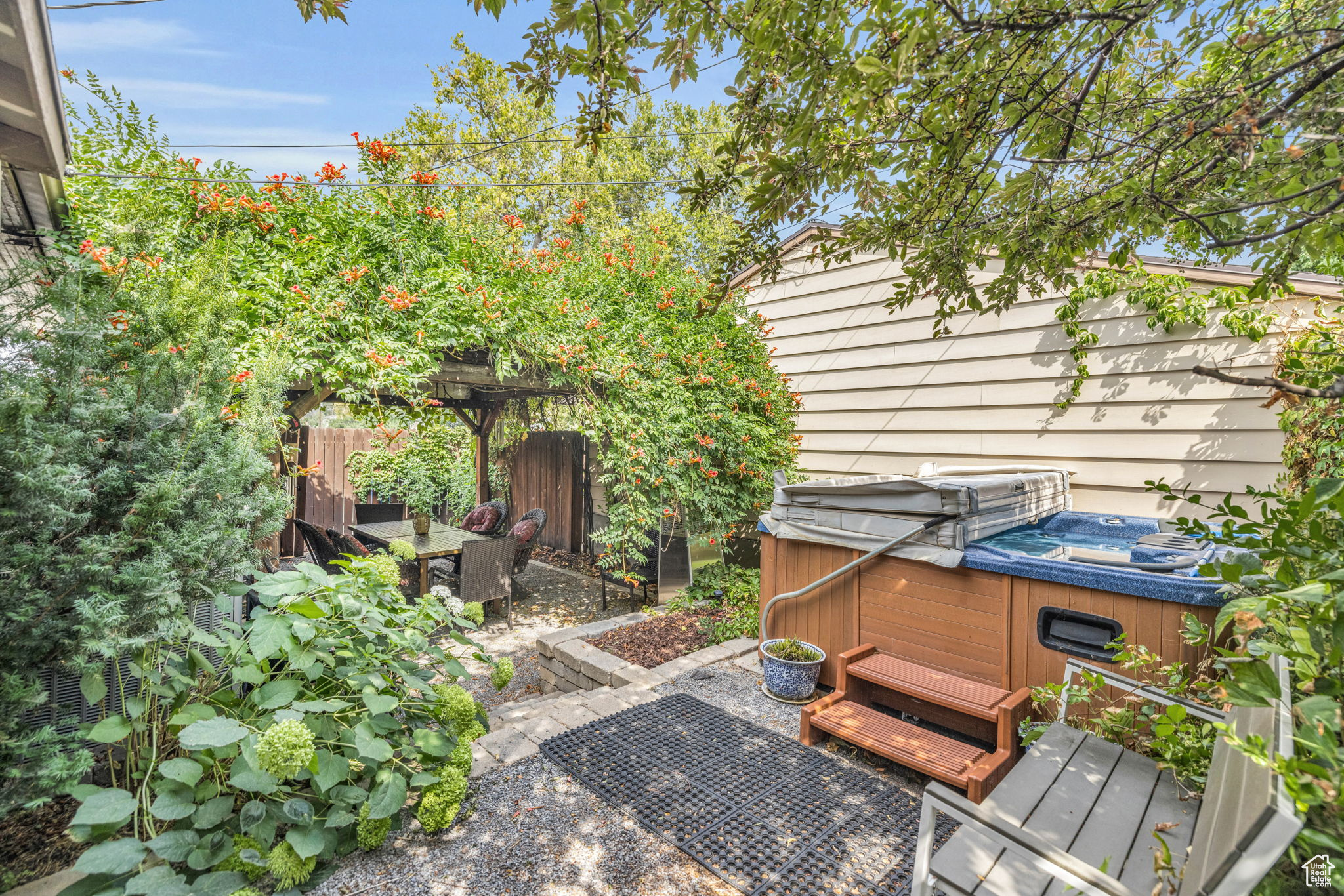 View of patio / terrace featuring a hot tub