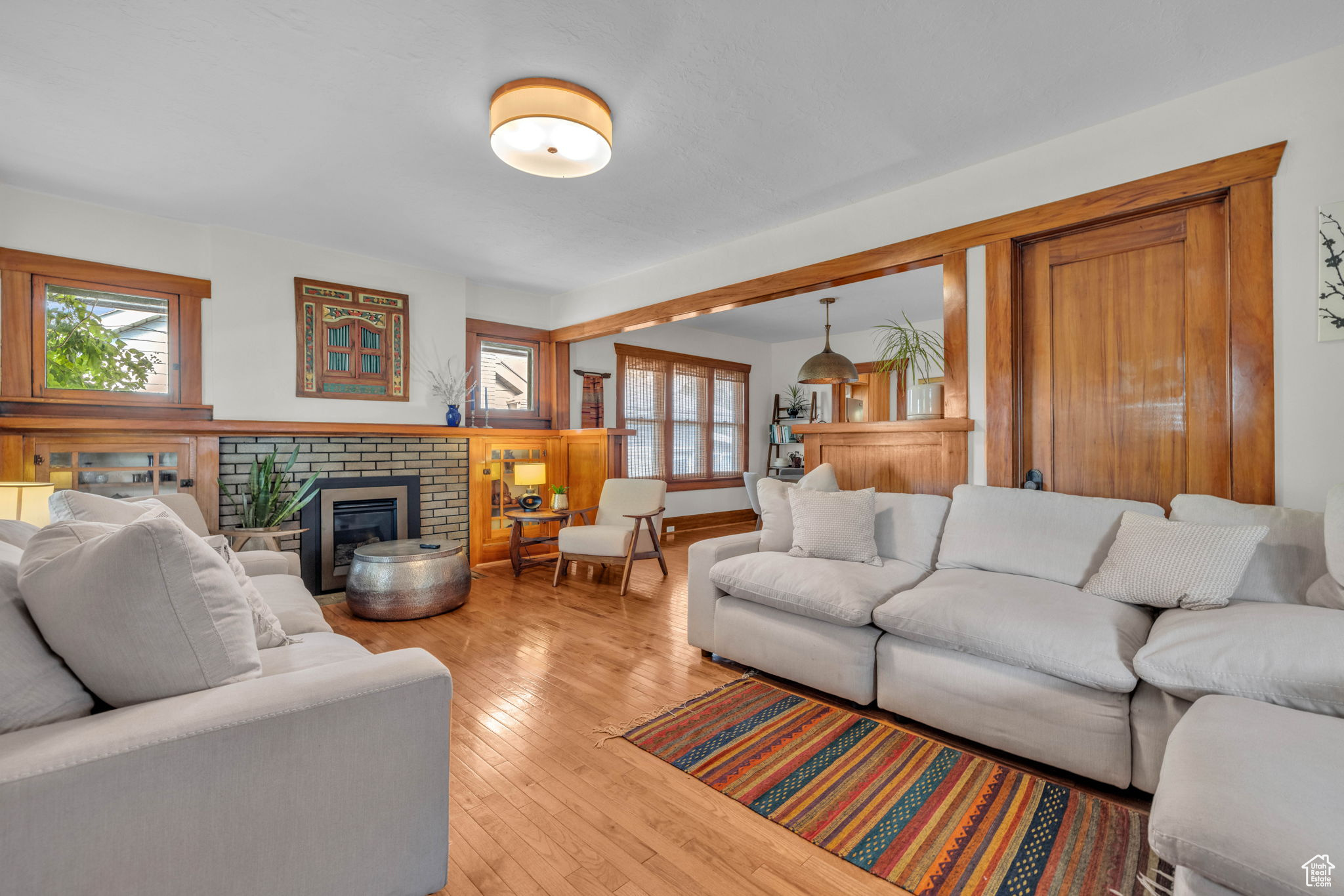 Living room featuring a fireplace and light hardwood / wood-style floors