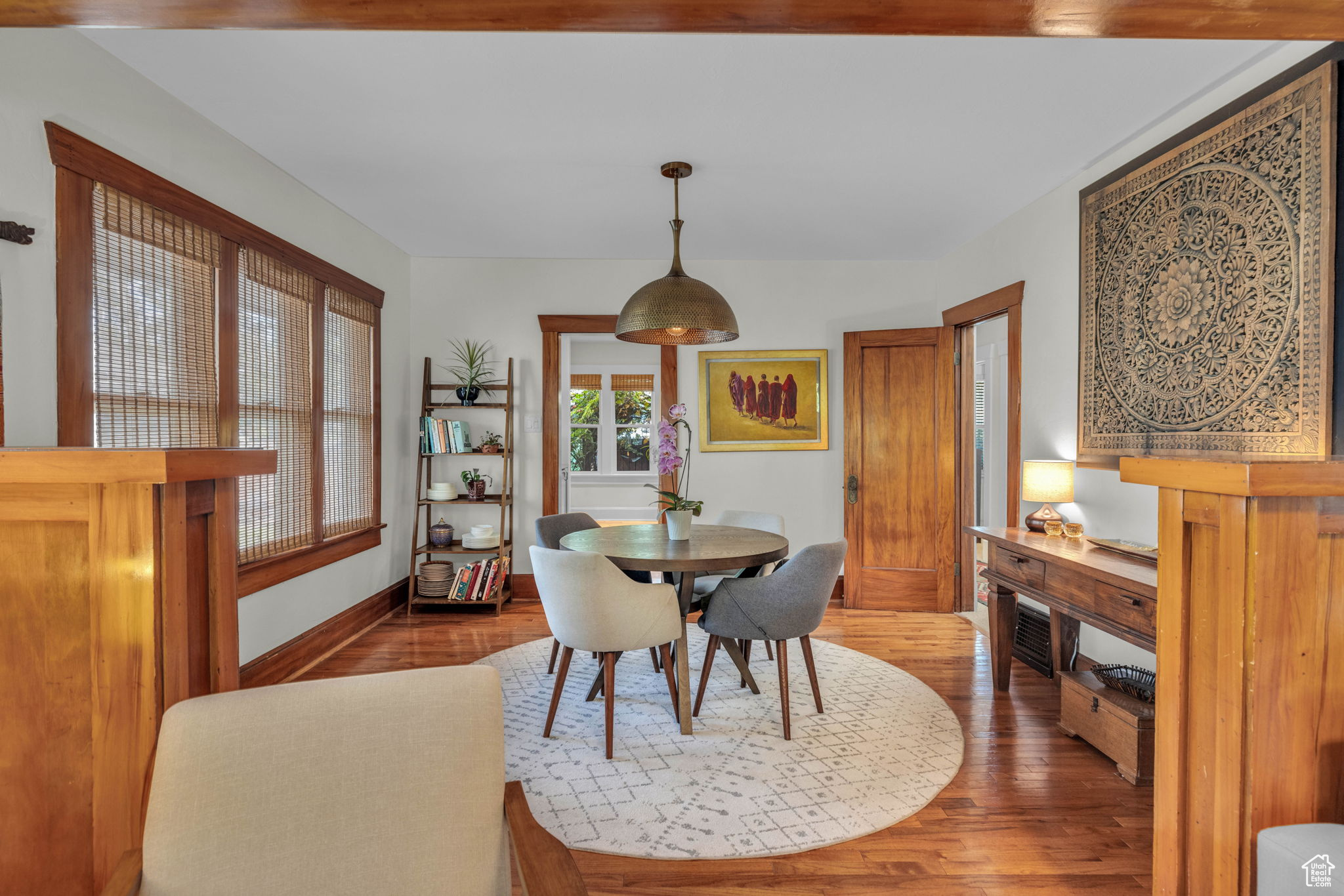 Dining space featuring dark wood-type flooring