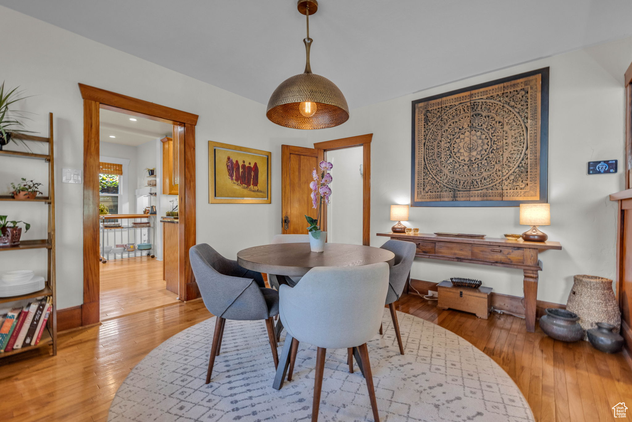 Dining area with hardwood / wood-style flooring