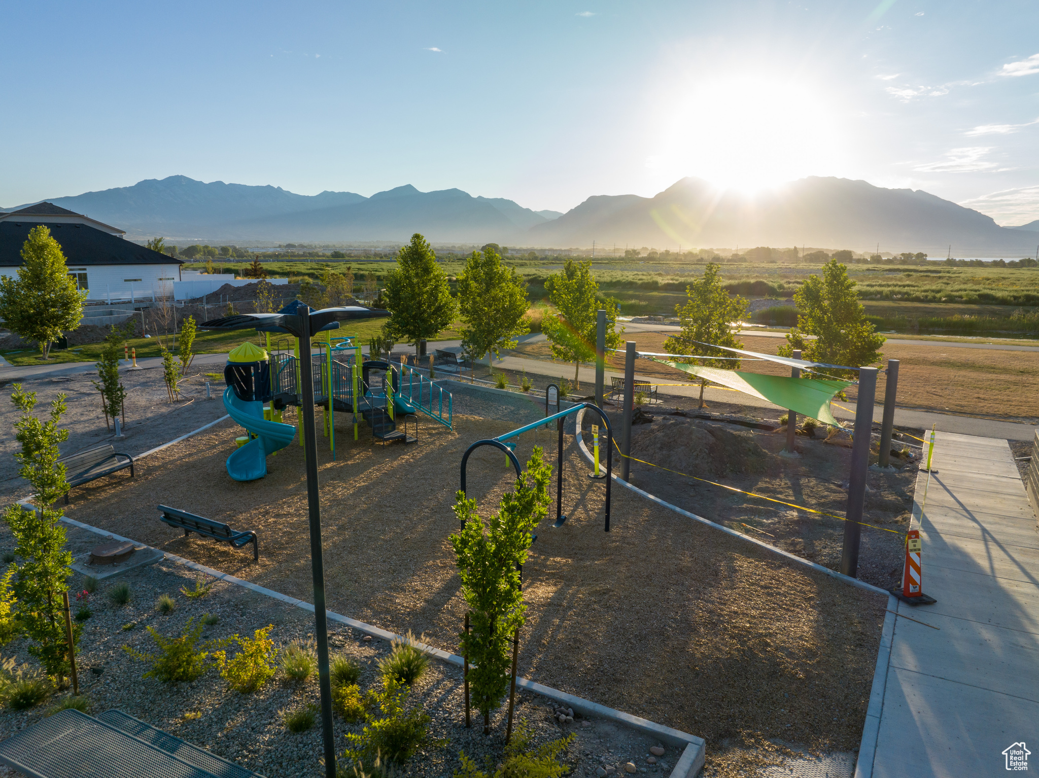 Exterior space featuring a playground and a mountain view