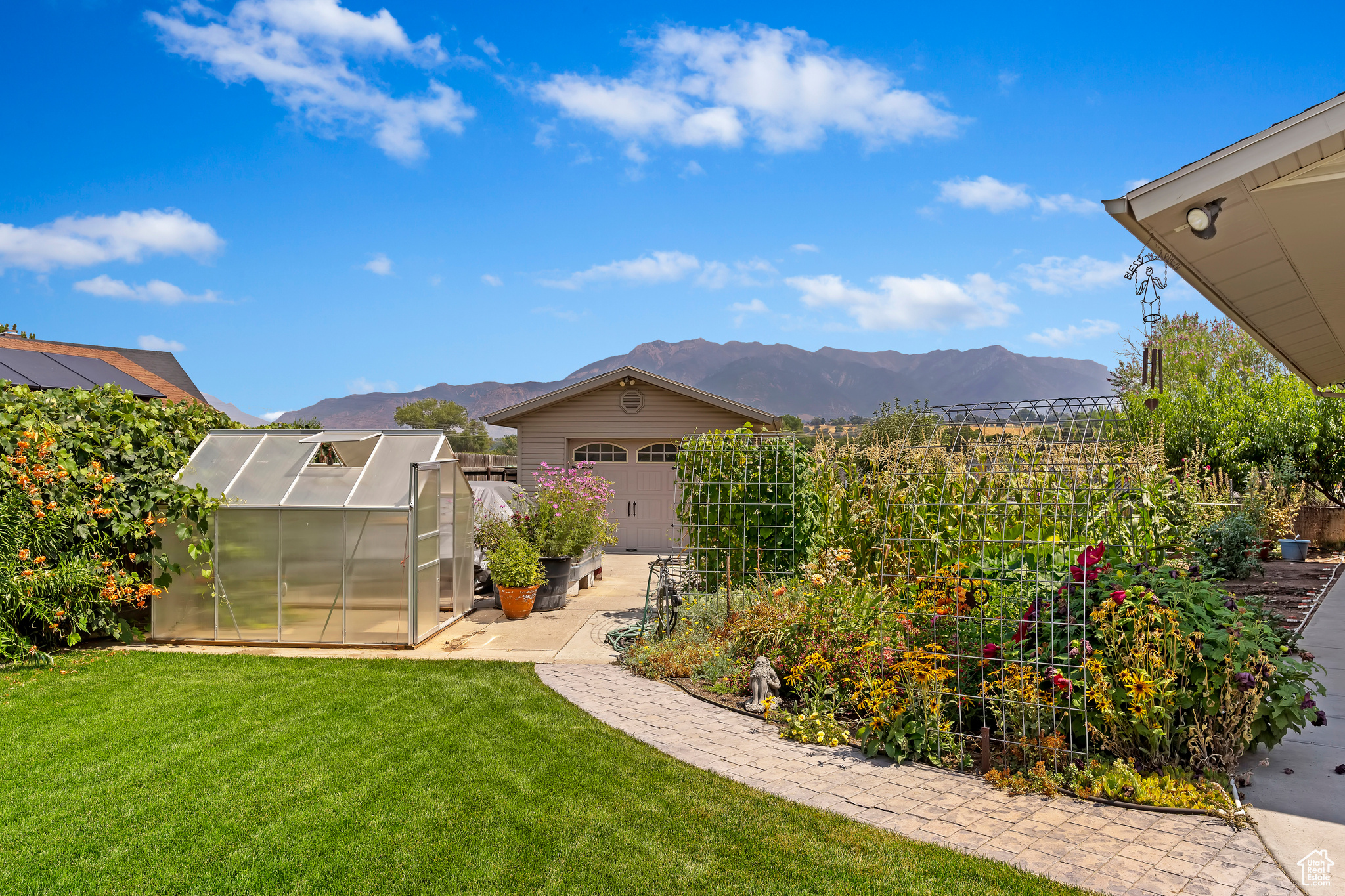 View of yard featuring a mountain view and an outbuilding