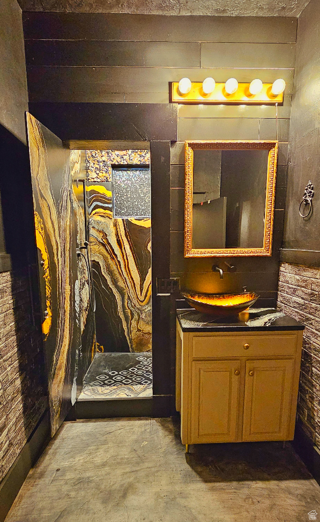 Bathroom with concrete flooring and vanity