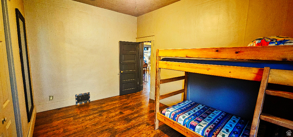 Bedroom featuring dark hardwood / wood-style floors