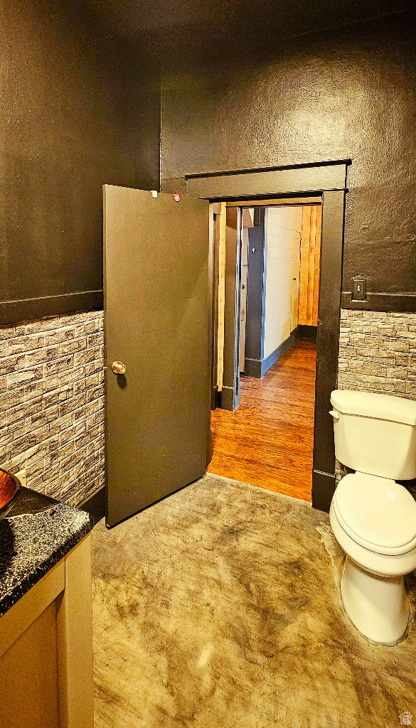 Bathroom featuring toilet and wood-type flooring