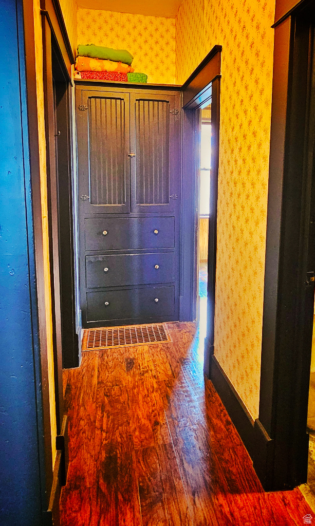 Hallway featuring dark hardwood / wood-style floors