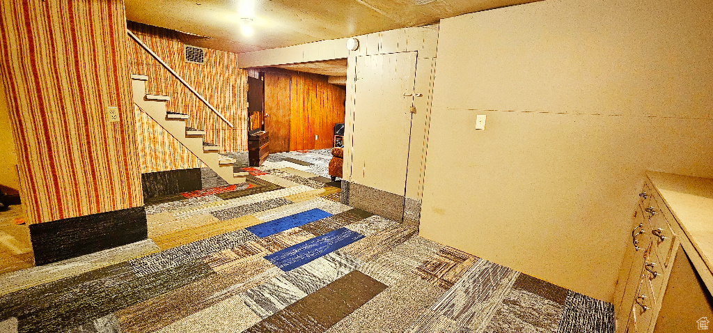 Hall featuring wood walls