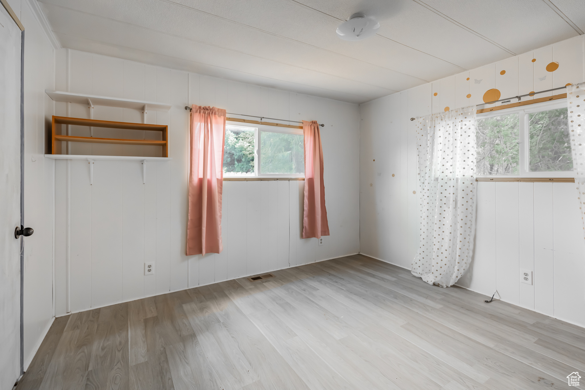 Spare room featuring light hardwood / wood-style flooring