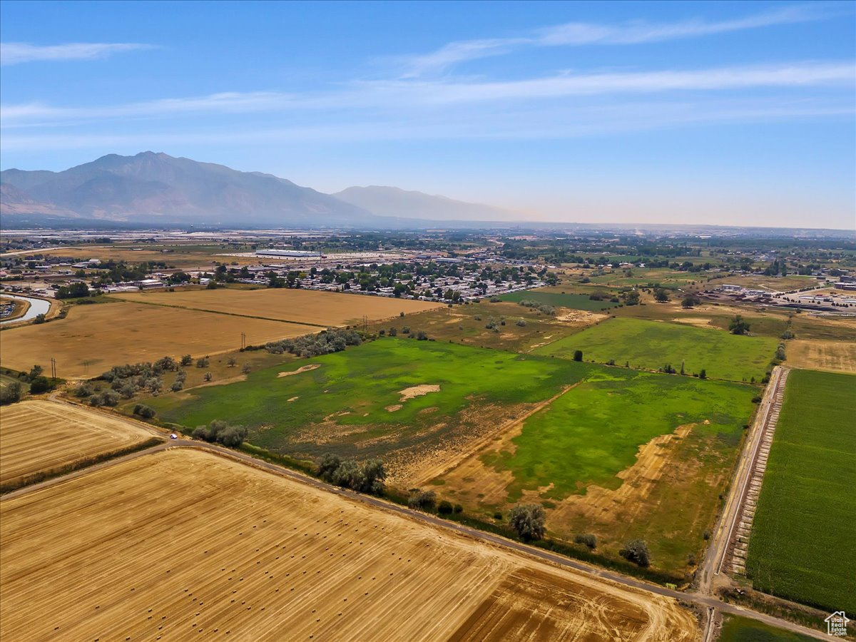 Birds eye view of property with a rural view and a mountain view