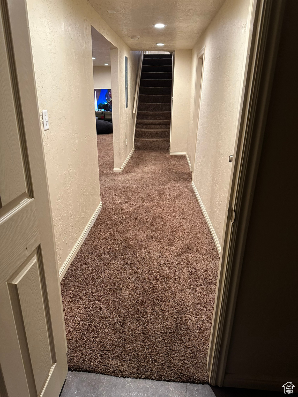 Stairs to basement and hallway