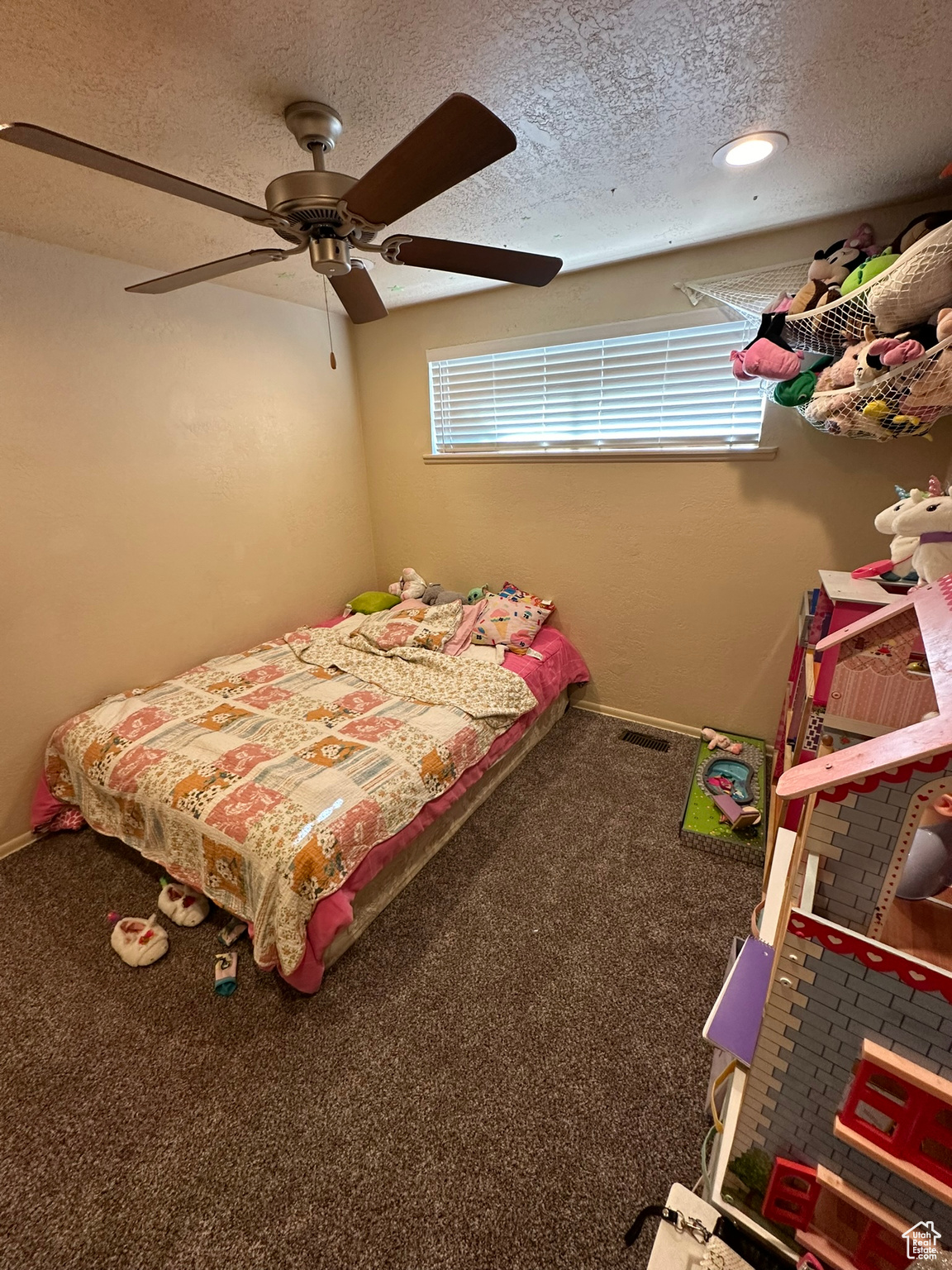 3rd bedroom with can lighting, ceiling fan and brand new carpet