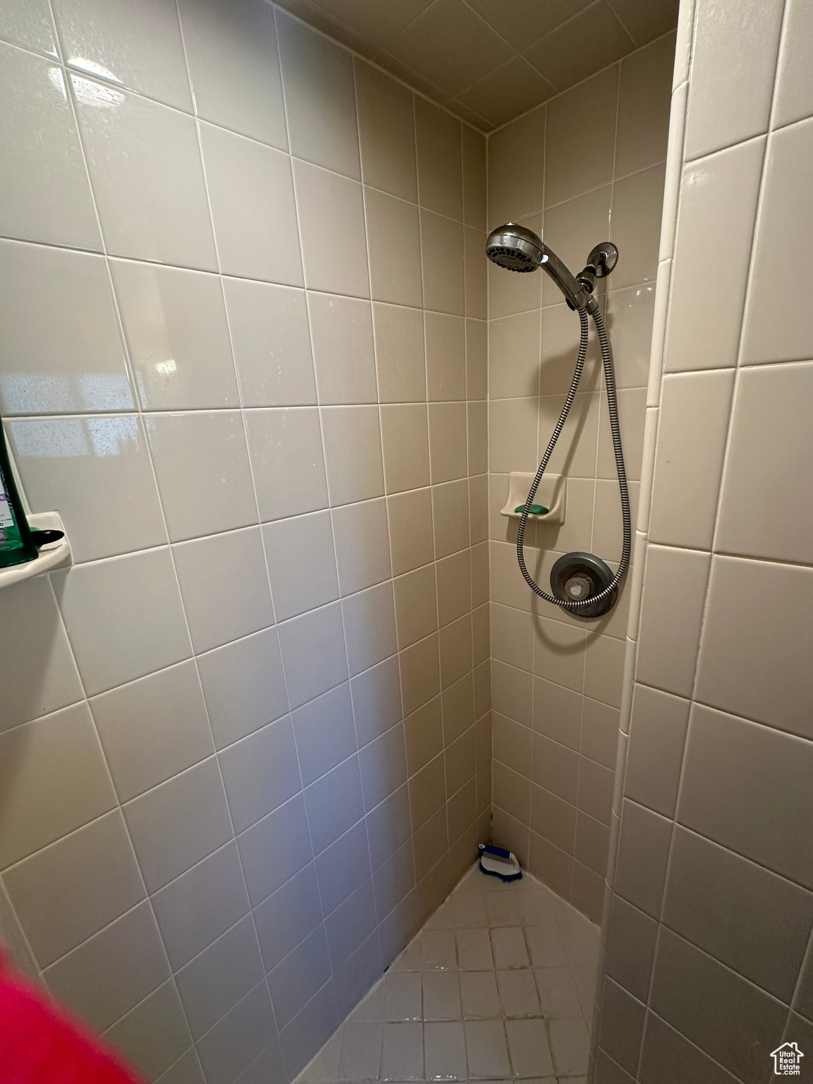 Primary bathroom featuring tiled shower