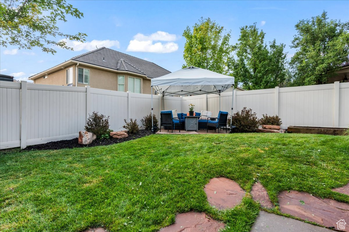 View of yard featuring an outdoor hangout area, a patio area, and a gazebo