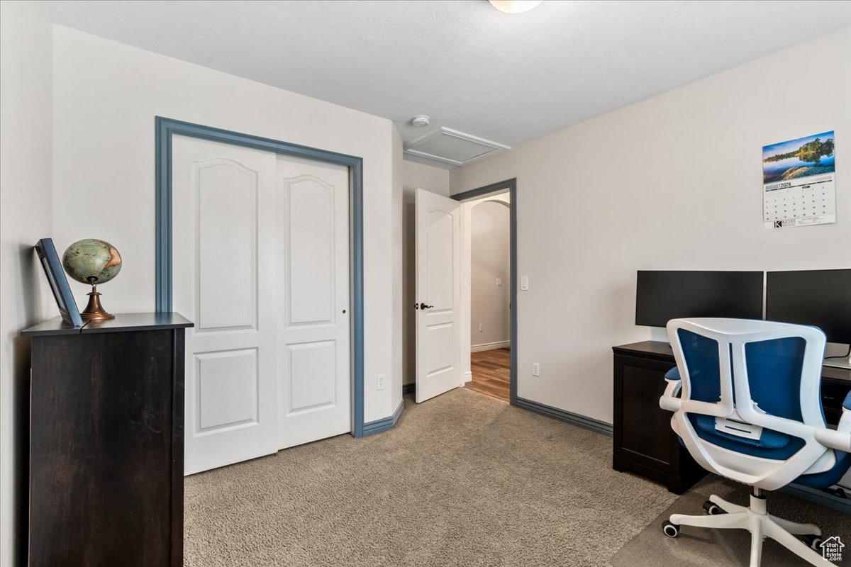 Office space featuring light colored carpet