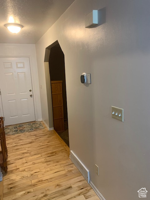 Hall with light wood-type flooring