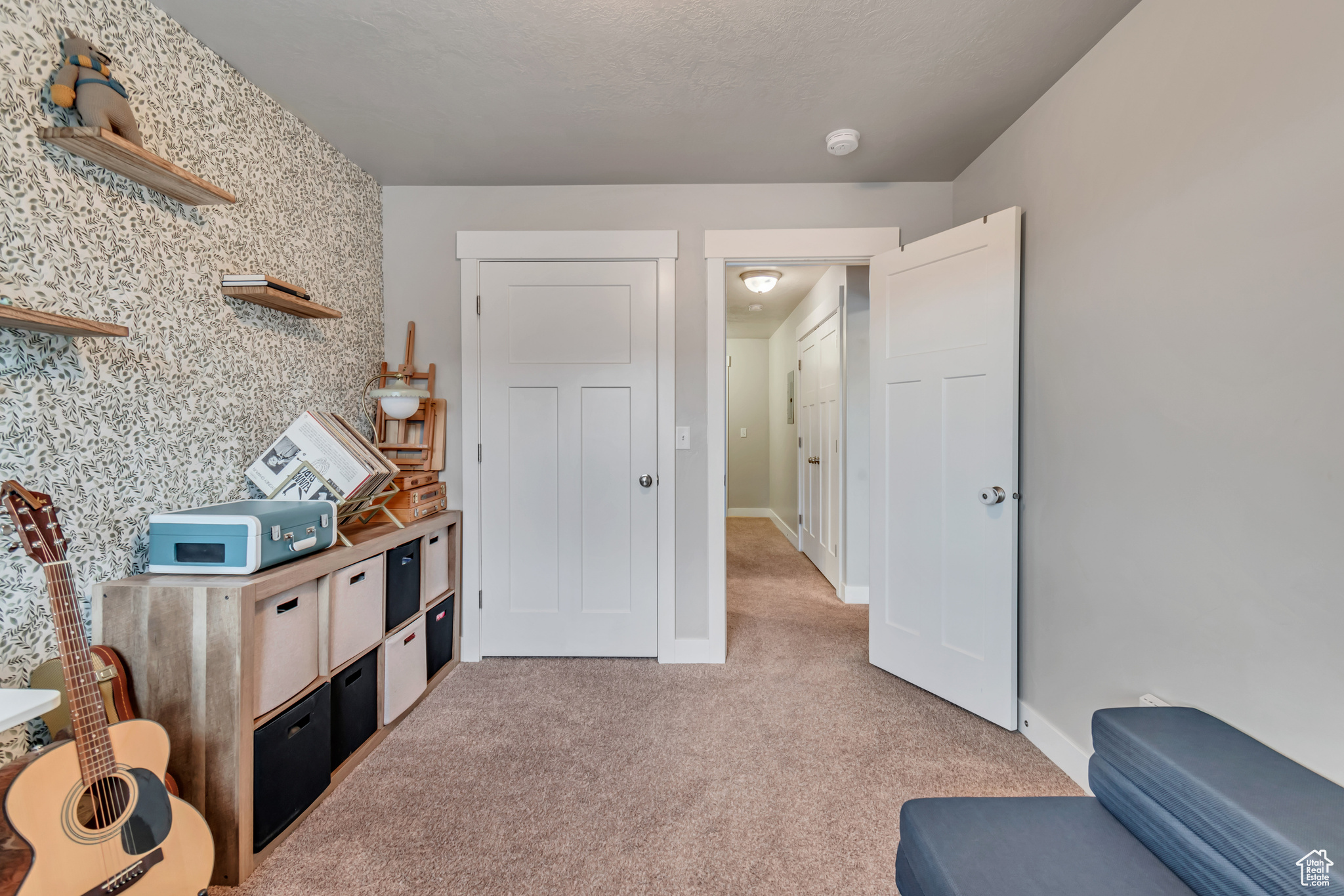 Living area featuring light colored carpet