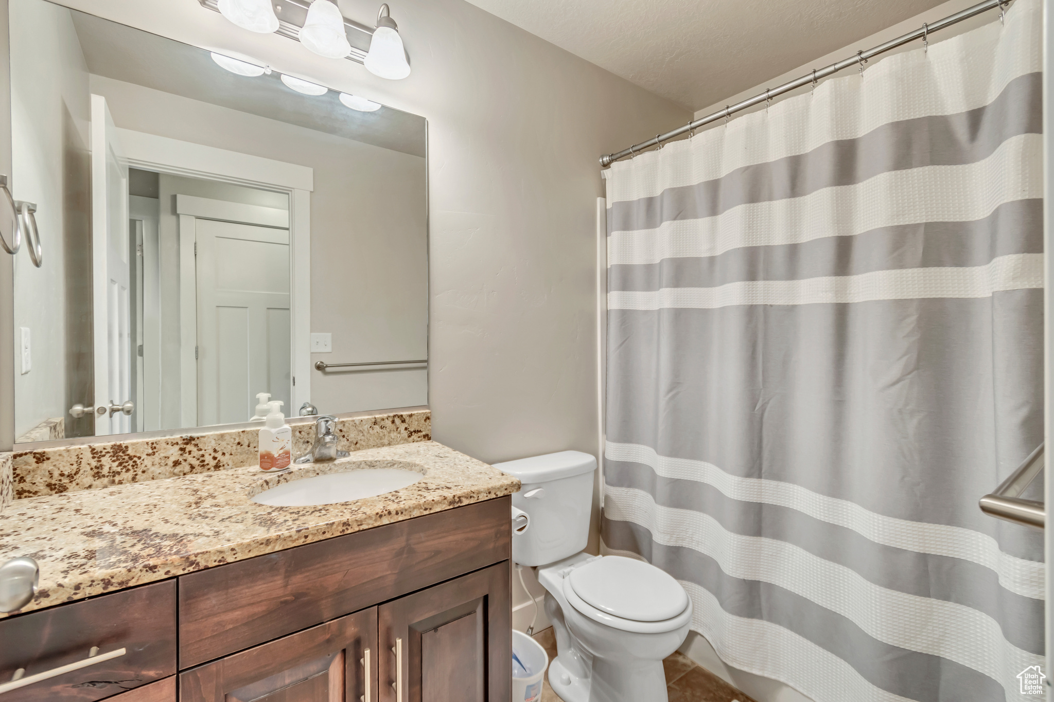 Bathroom with vanity and toilet