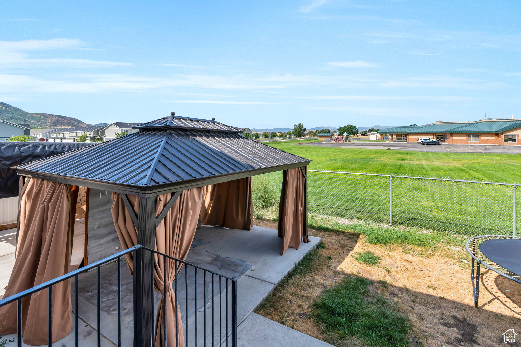 Exterior space featuring a lawn and a gazebo