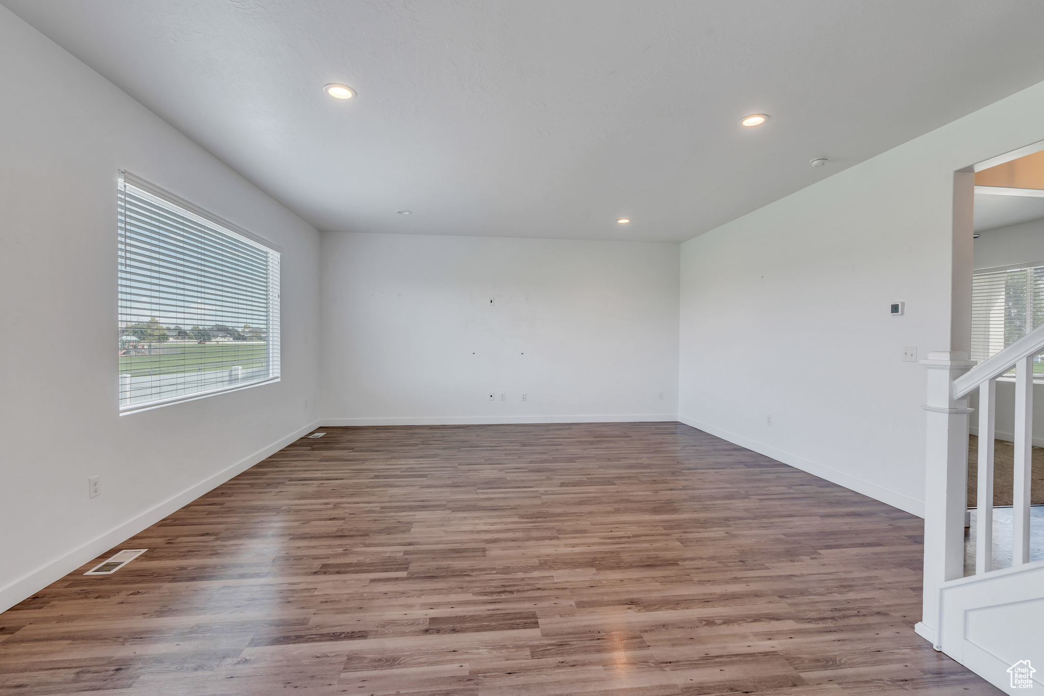 Spare room featuring hardwood / wood-style floors