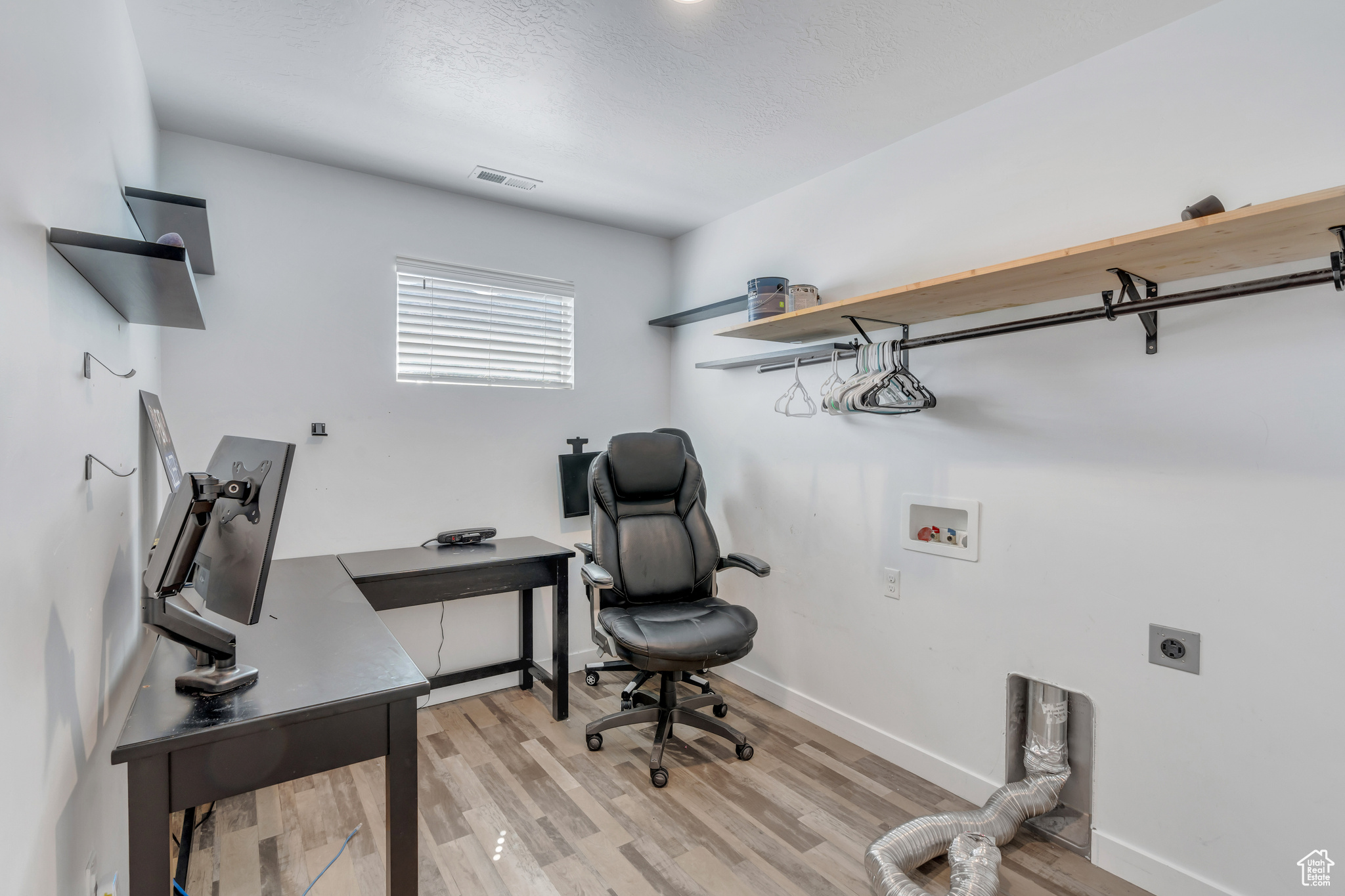 Office area featuring light hardwood / wood-style flooring