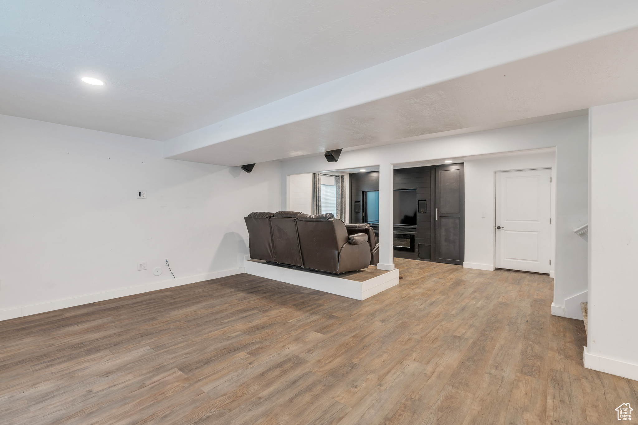 Unfurnished living room with light wood-type flooring