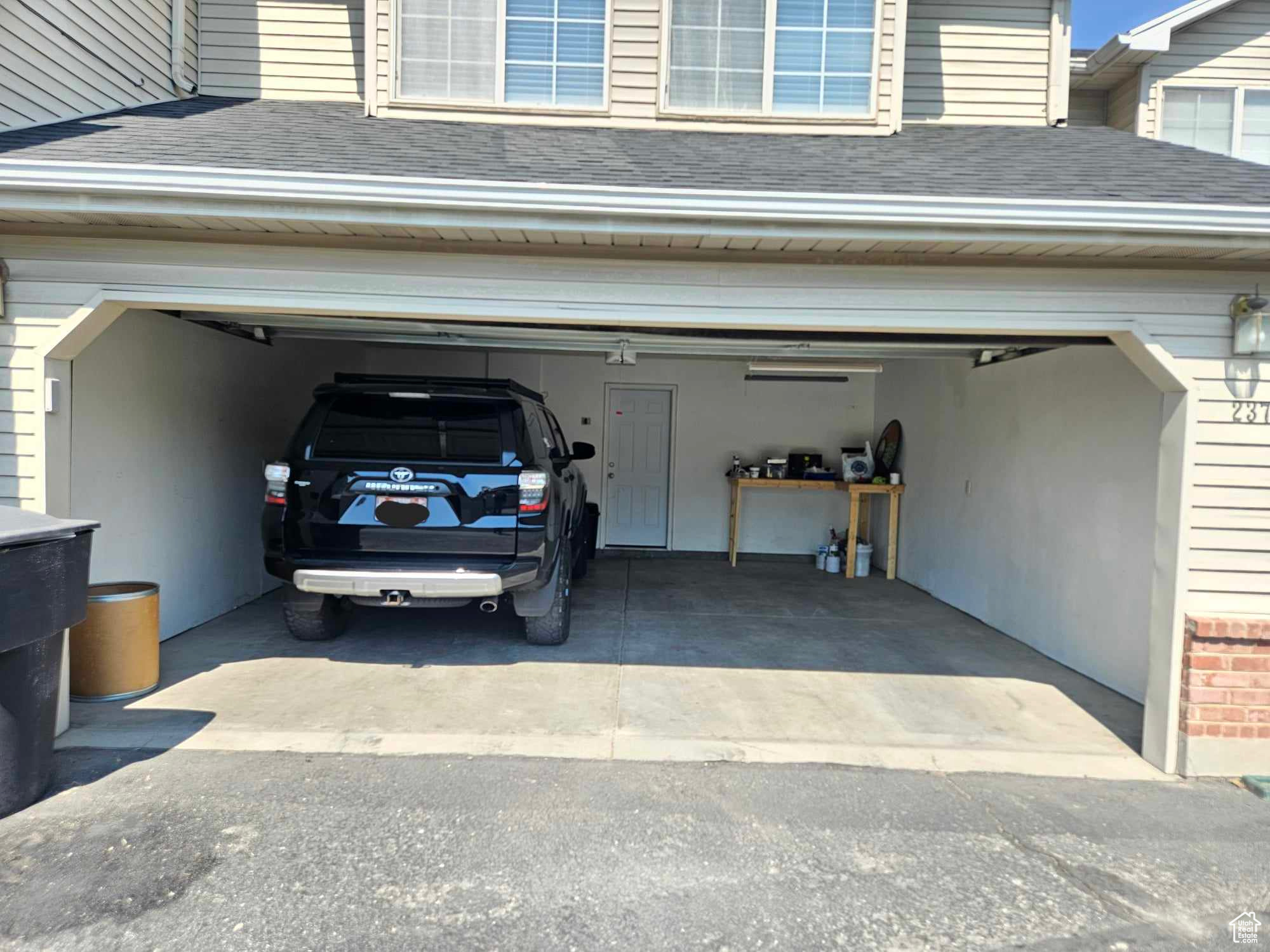 Garage featuring a carport