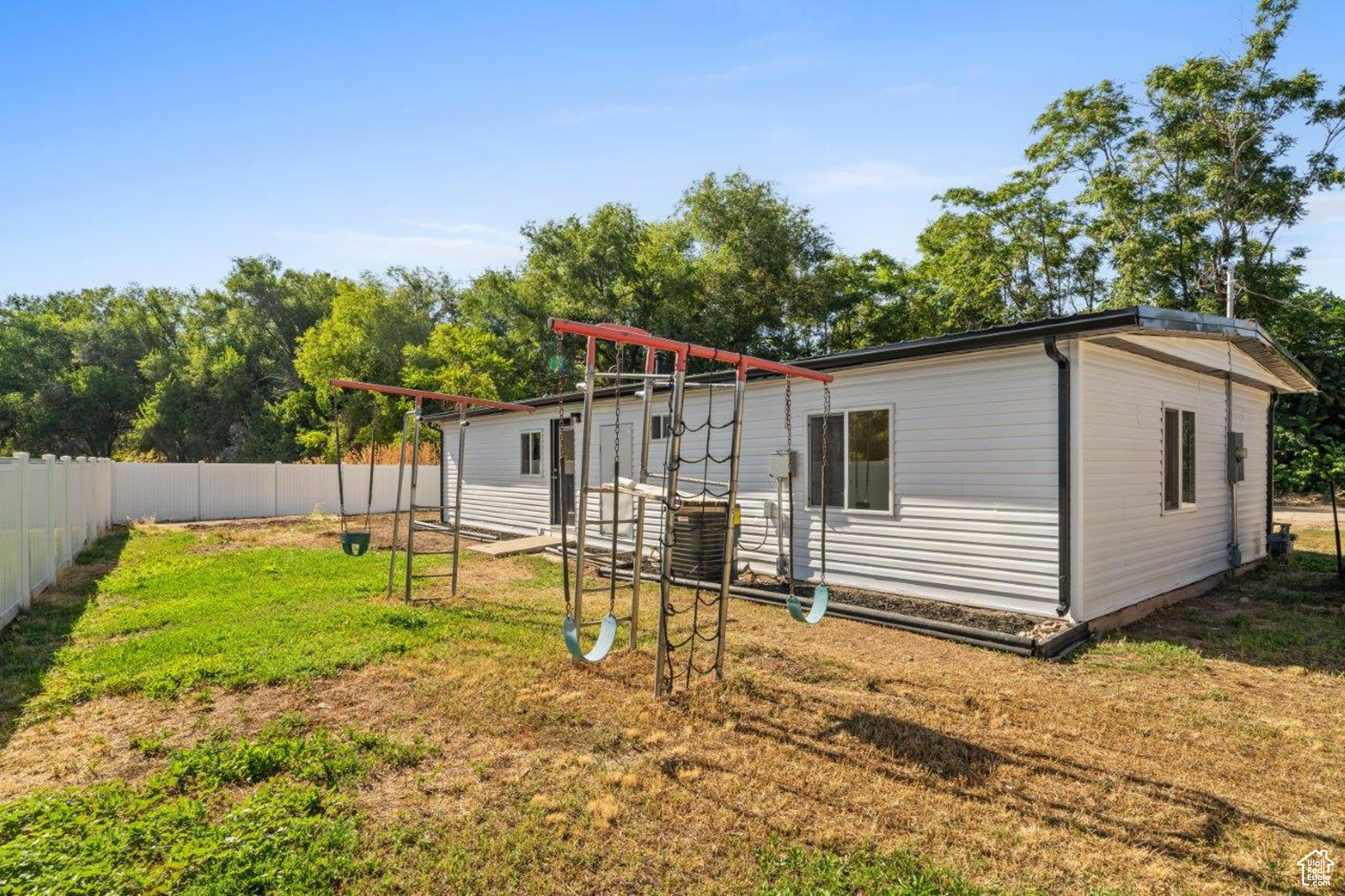 Rear view of property featuring a yard