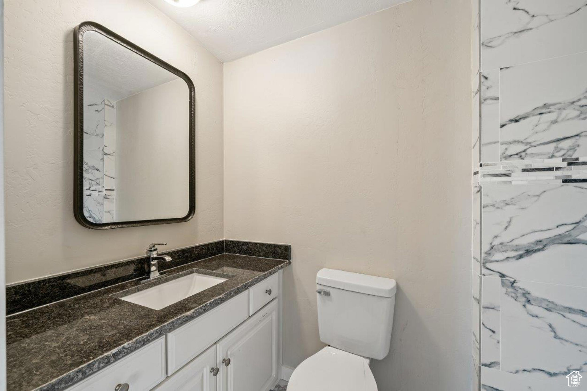 Bathroom featuring toilet and vanity