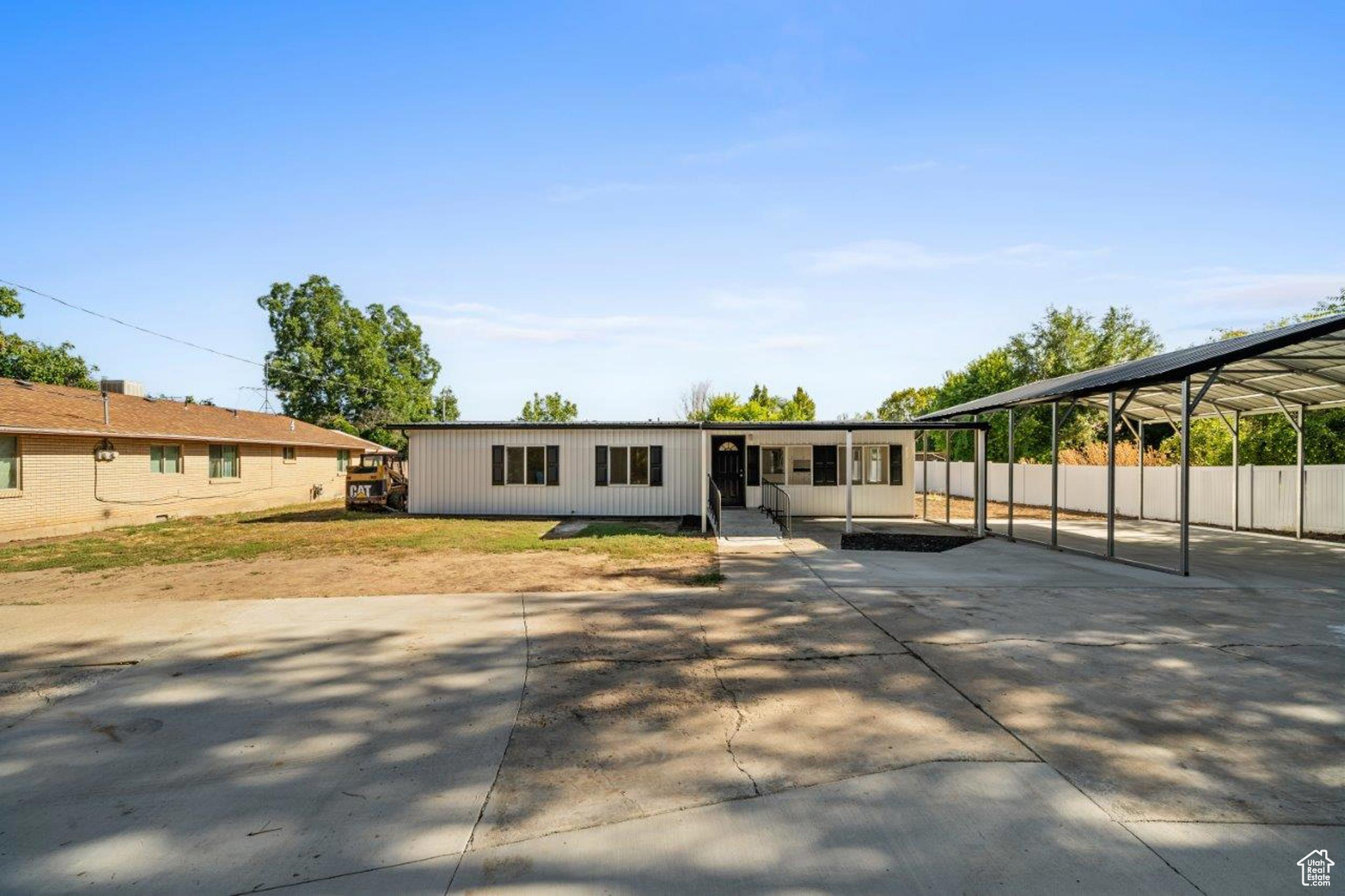 View of front facade featuring a carport