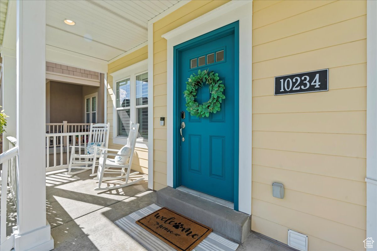 View of exterior entry featuring a porch