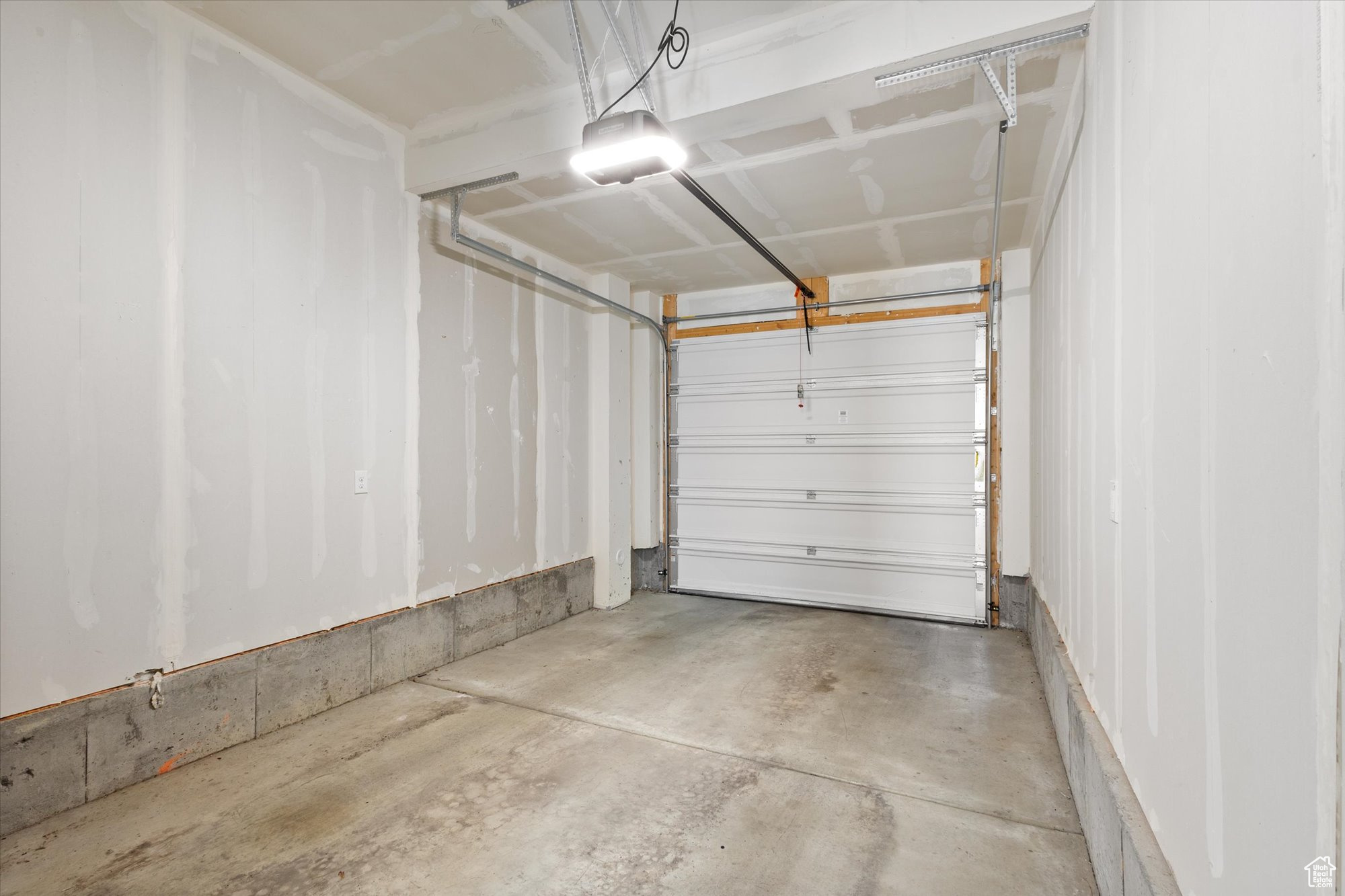 Garage featuring a garage door opener