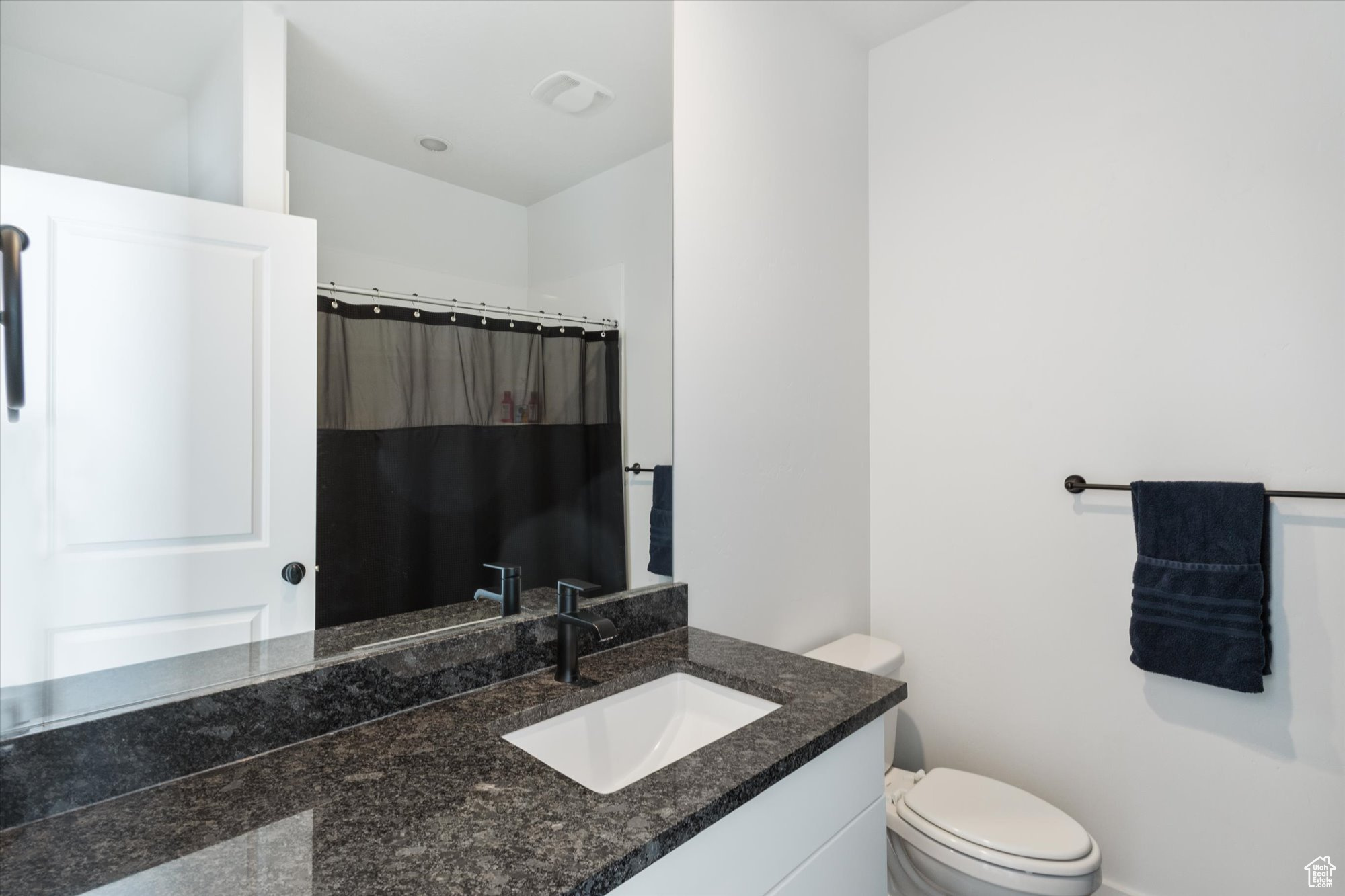 Bathroom featuring toilet and vanity