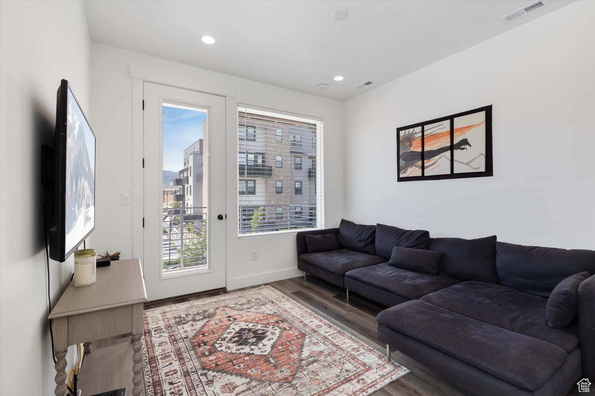 Living room with wood-type flooring