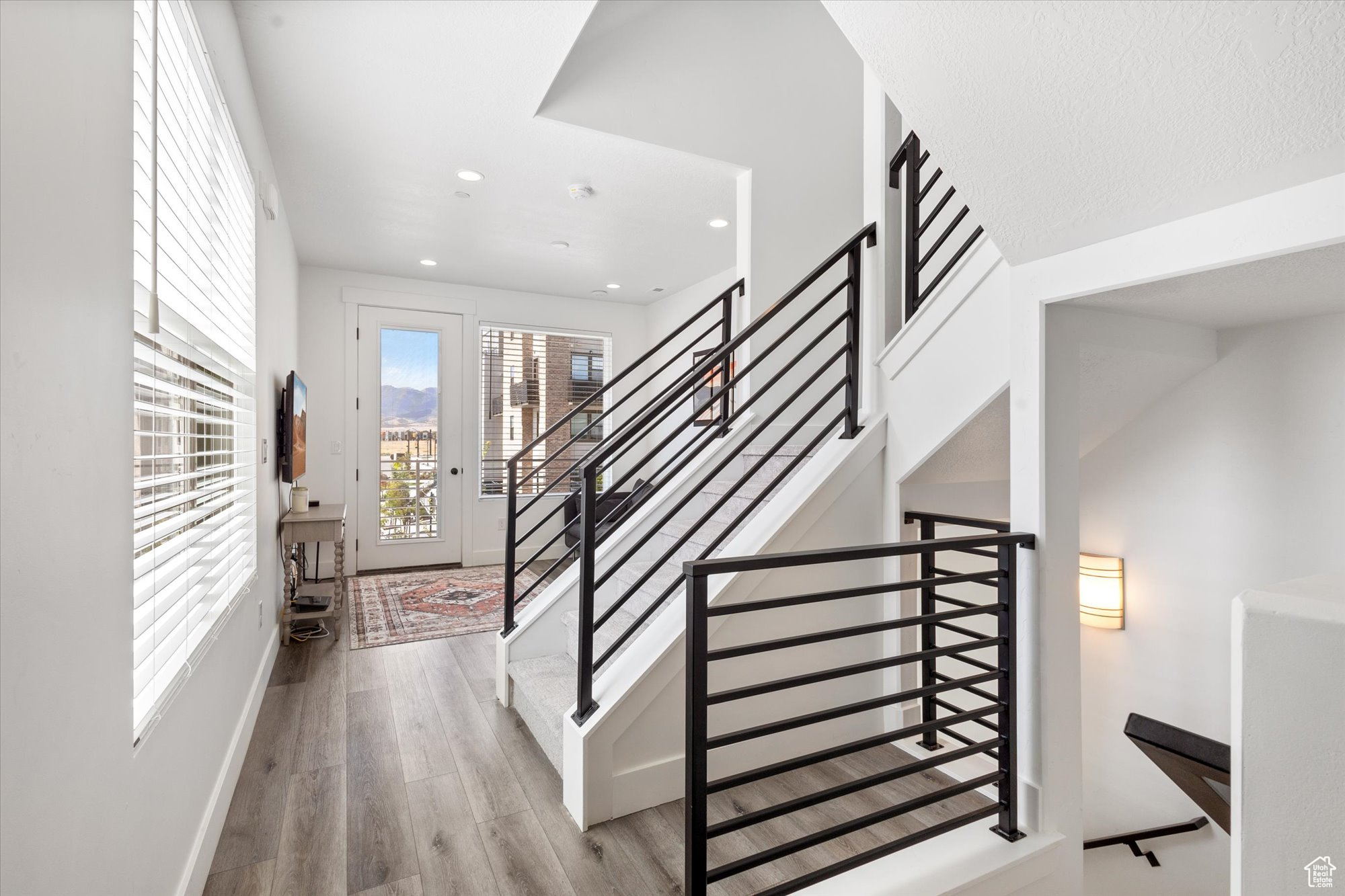 Stairway with hardwood / wood-style flooring