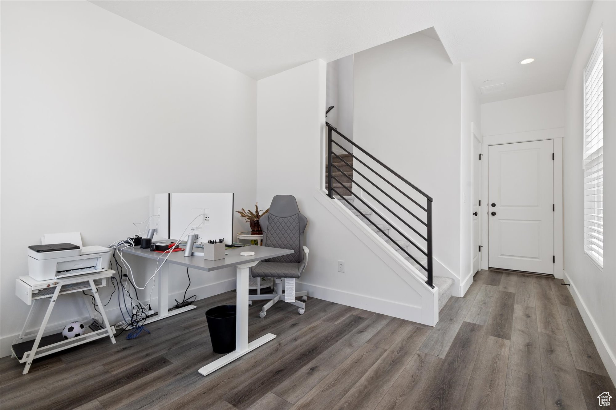 Office area featuring hardwood / wood-style flooring