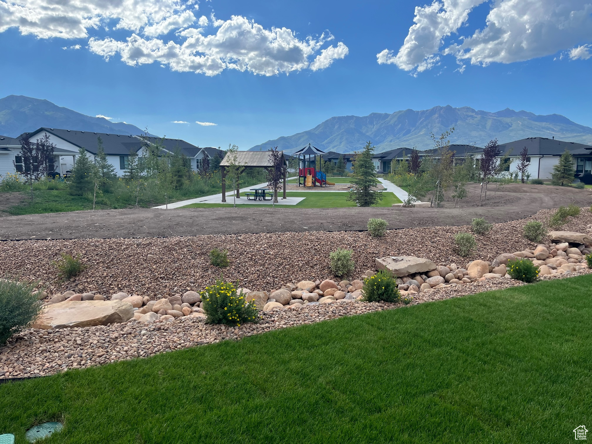 Property view of mountains and the community park.