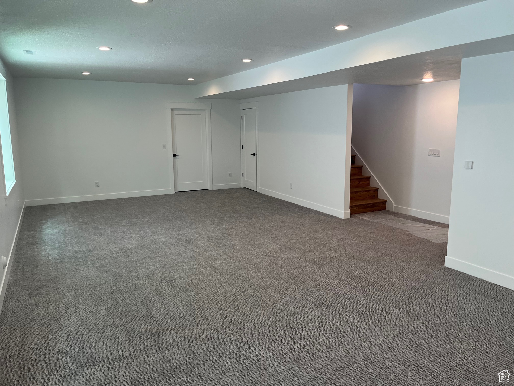 Basement with carpet flooring