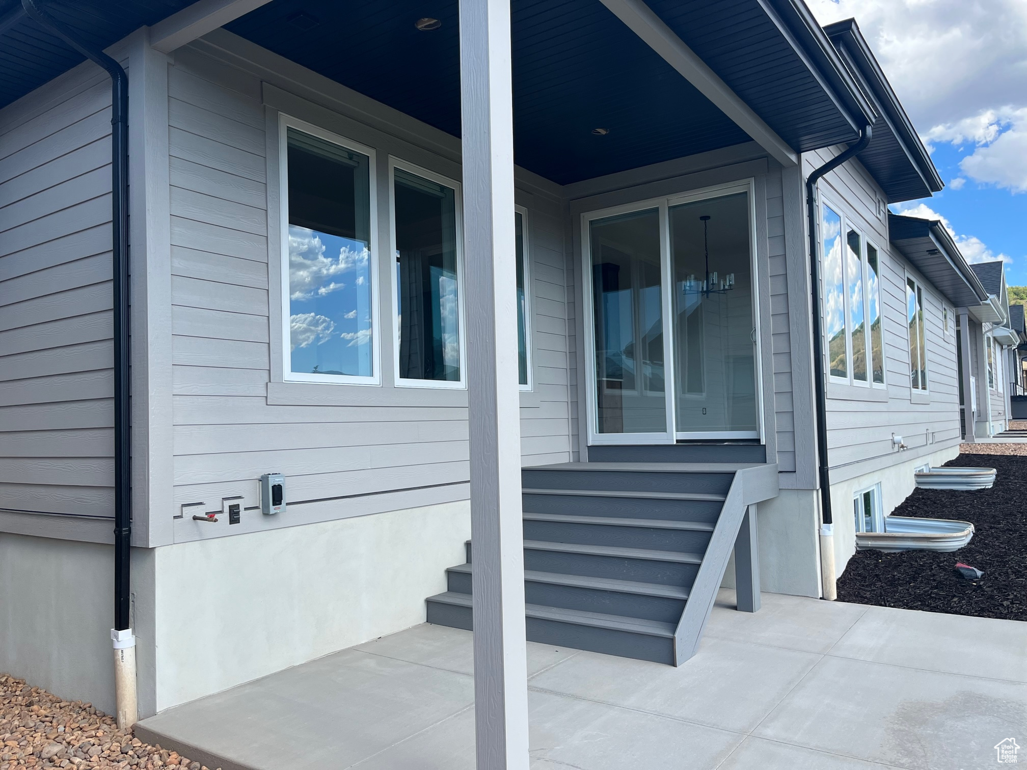 View of property exterior featuring a patio