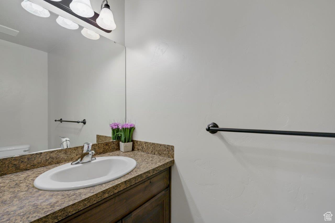 Bathroom with vanity and toilet