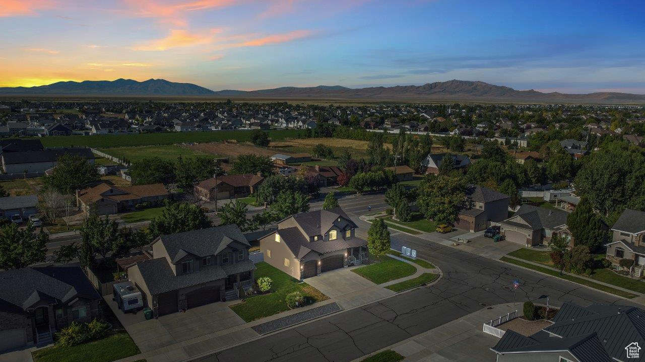 Aerial view at dusk featuring a mountain view