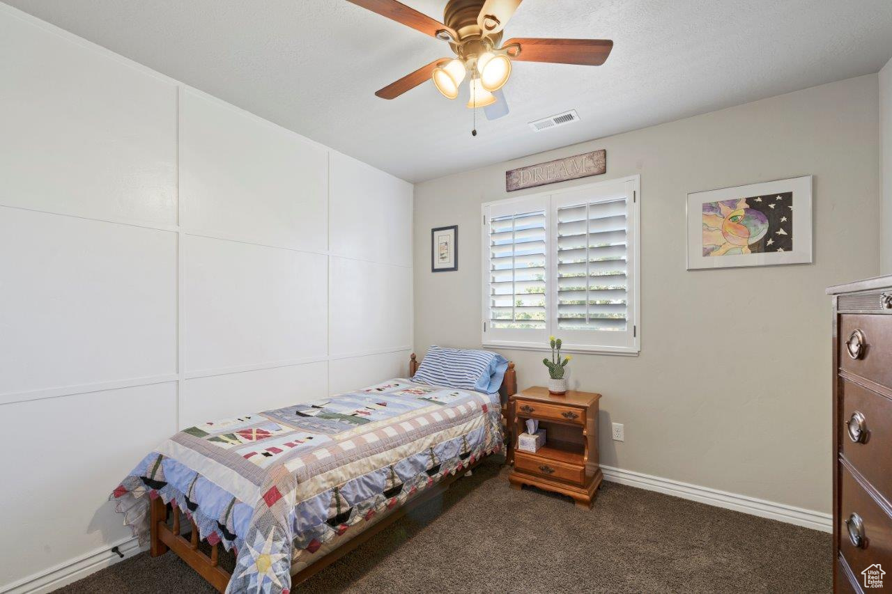 Bedroom with carpet and ceiling fan