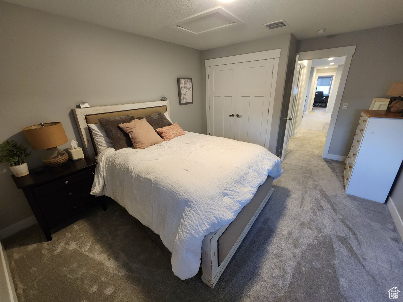 Bedroom with carpet and a closet