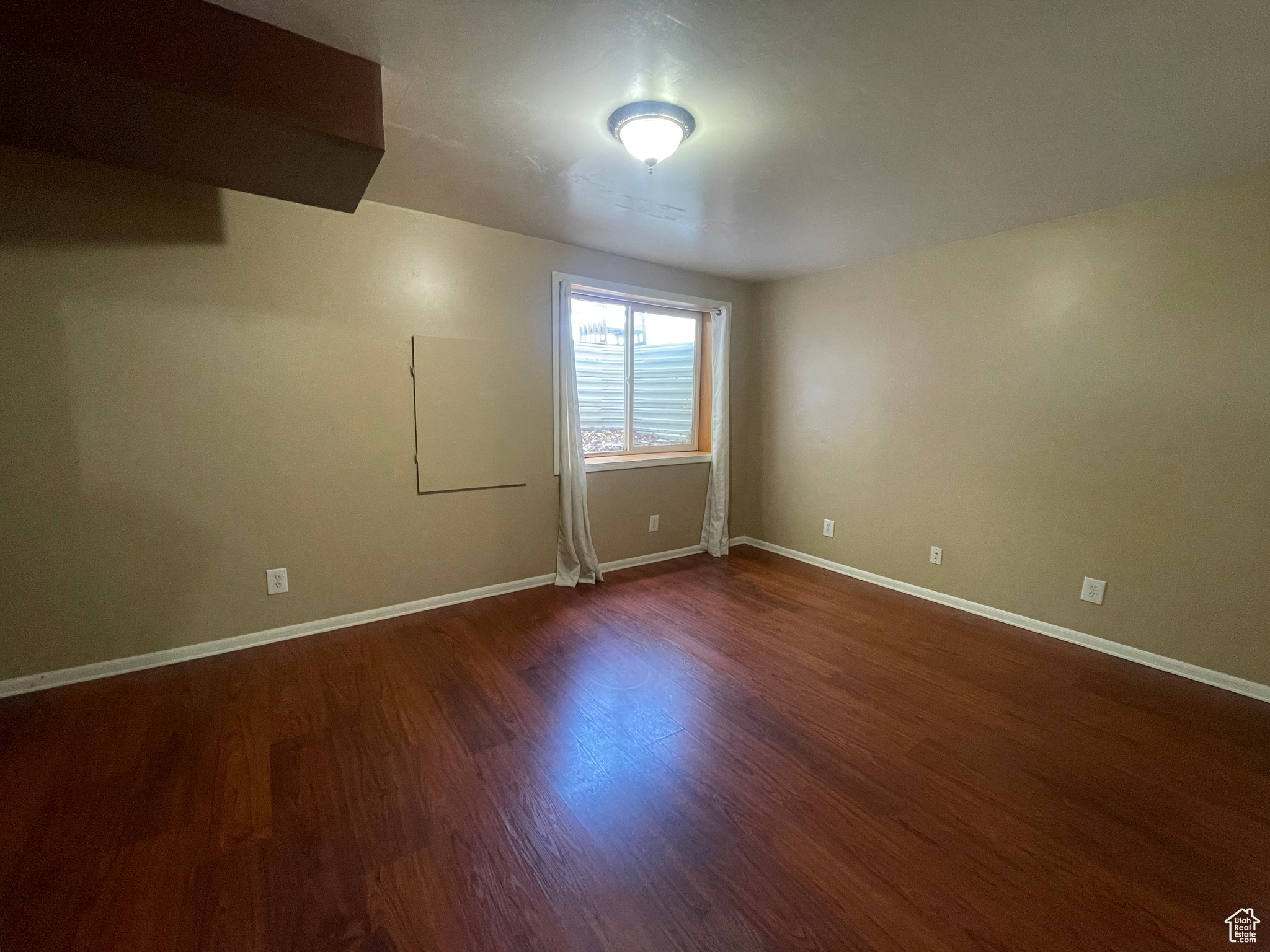 Many options for this space I dig the large slider window so it could actually be a guest space or additional bedroom if a closet was builtin or a wardrobe added.