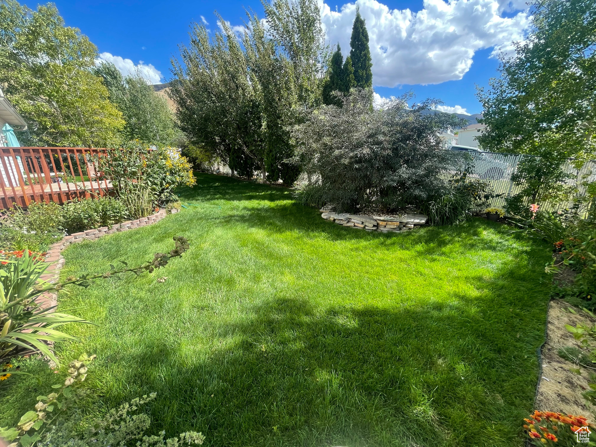 This Backyard has amazing privacy and areas to play or hide or sit and chill, read view the mountains and just disappear.
