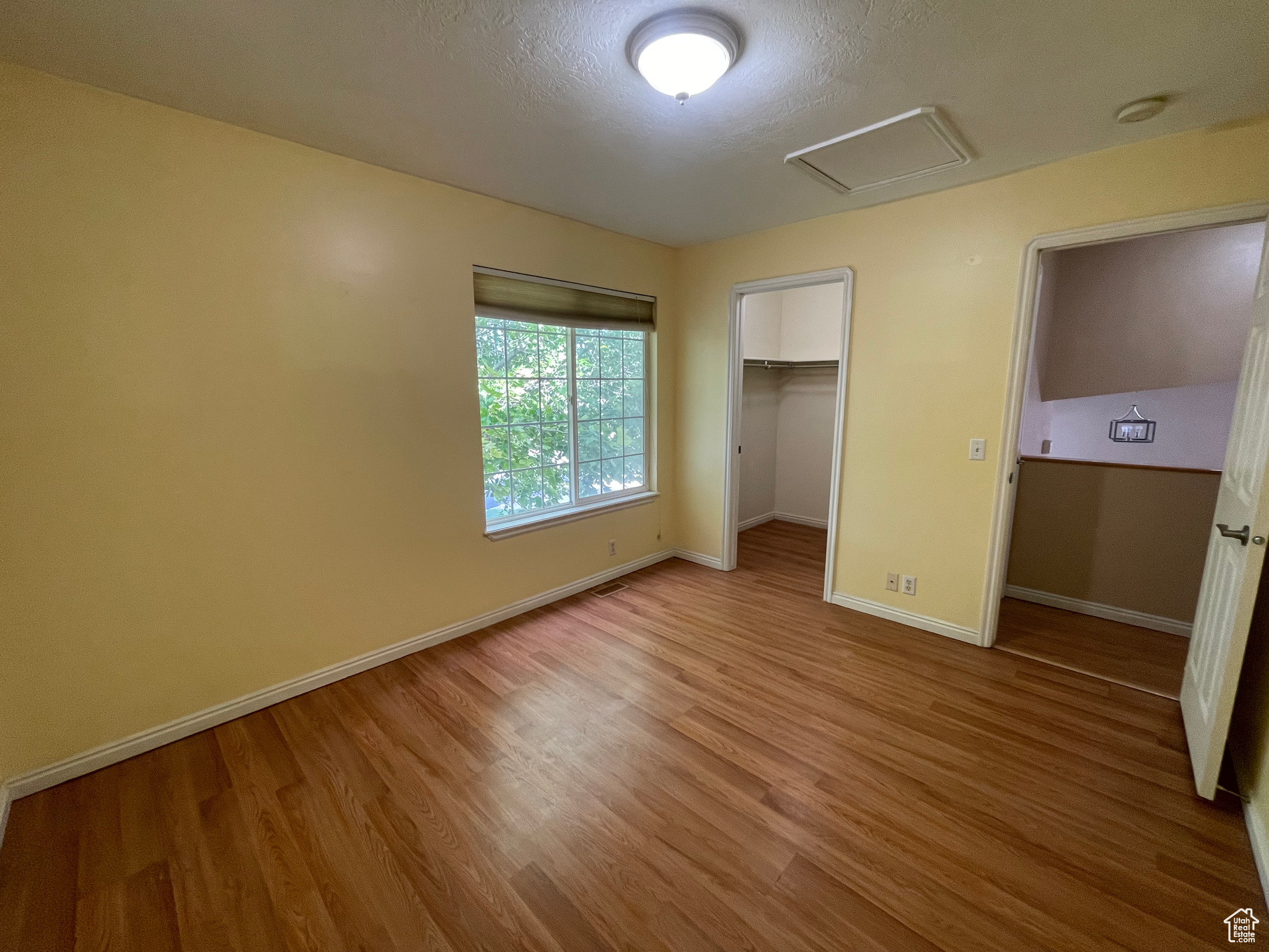 Bedroom w/ Walk-in Closet and large slider window