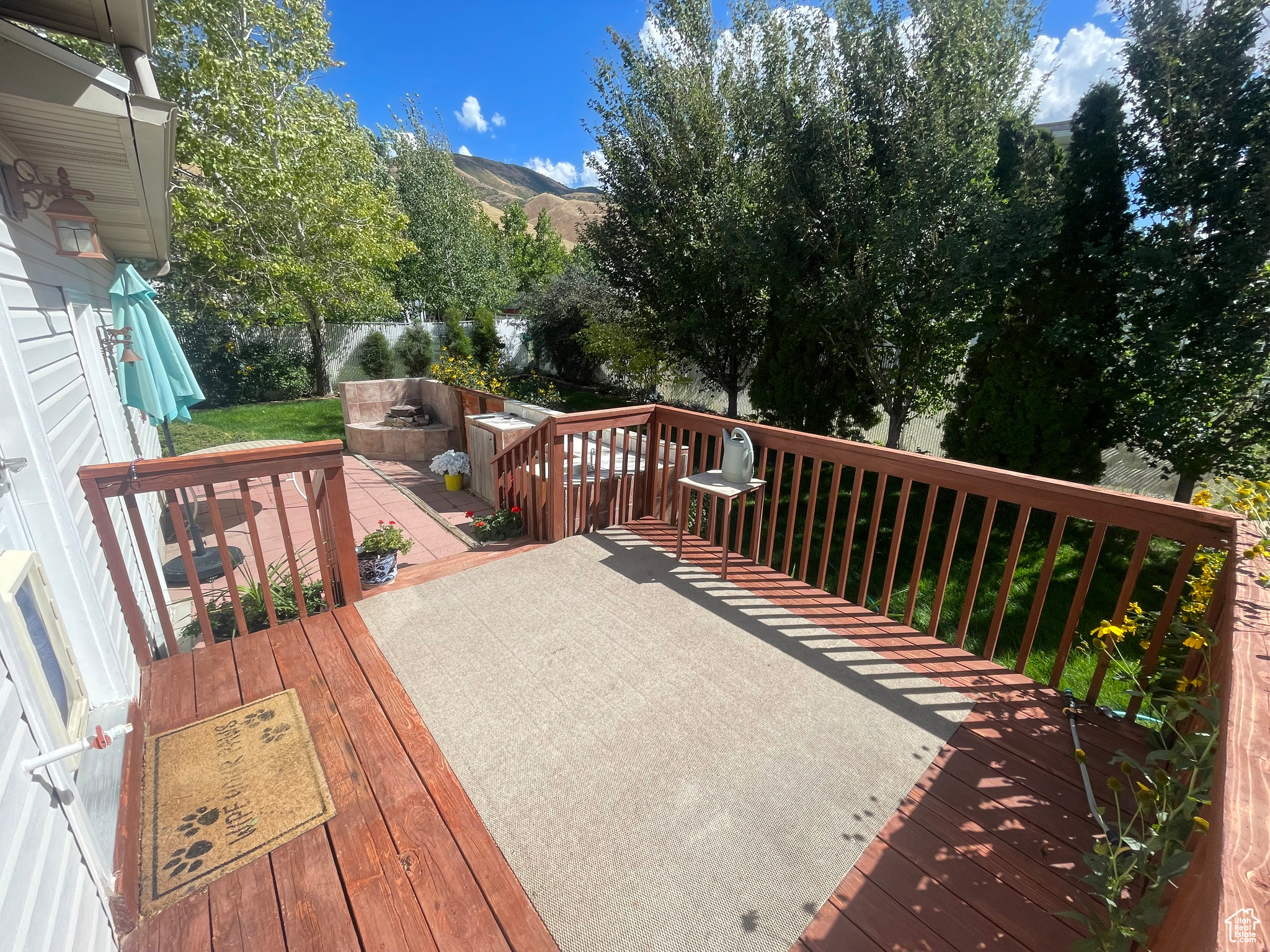 Deck off the Kitchen through back door and has it's own gas, electrical and plumbing for the  outside kitchen area attached. Great space and so private yet open and peaceful.