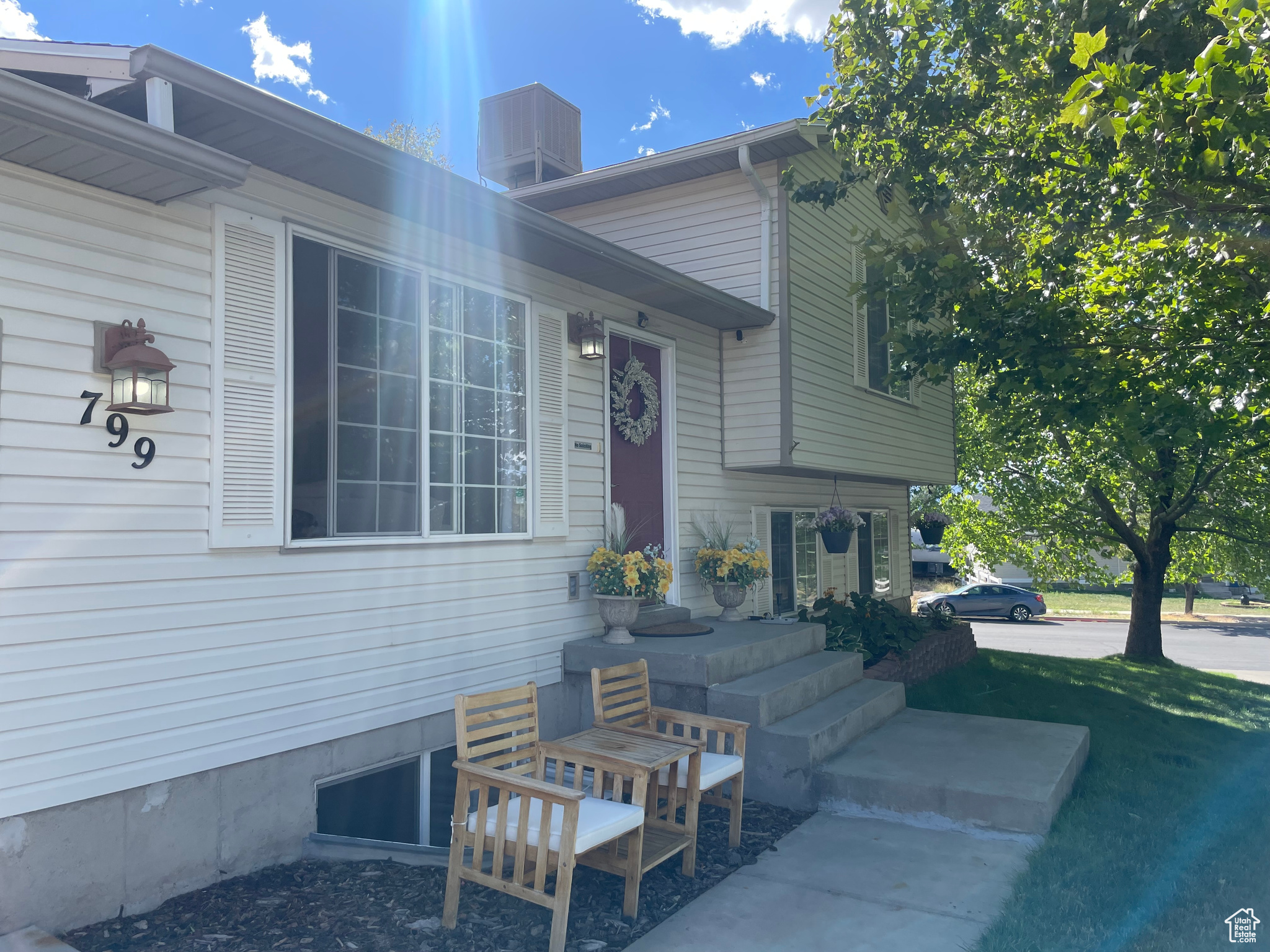 Front of Home with large double slider window with attractive mullions.